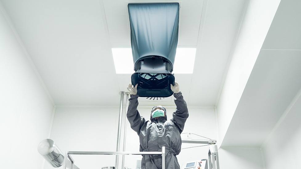 Medical personnel adjusting equipment